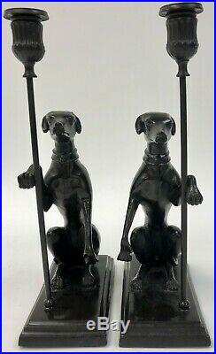 A Vintage Pair of Brass / Bronze Seated Greyhound Candlesticks