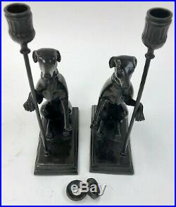 A Vintage Pair of Brass / Bronze Seated Greyhound Candlesticks