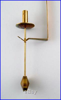 A pair of Skultuna, Sweden, brass candlesticks. Designer Pierre Forsell