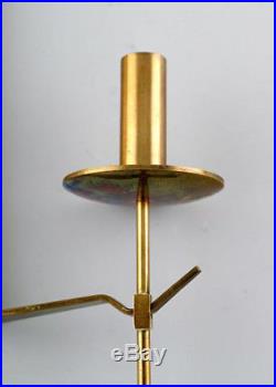 A pair of Skultuna, Sweden, brass candlesticks. Designer Pierre Forsell