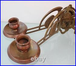 Art Nouveau pair of brass wall candle holders