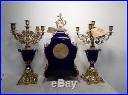Brass & Porcelain Clock Set With Matching 5 Candle Holders En Suite