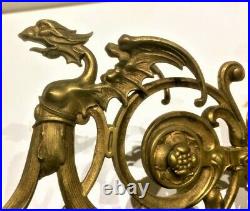 Brass wall mounted, swivel, winged dual dragons / griffins and wall medallion