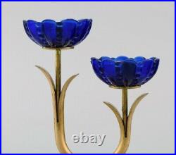 Gunnar Ander for Ystad Metall. Two candlesticks in brass and blue art glass