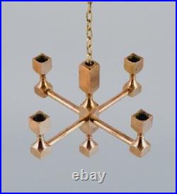 Gusum Metall, Sweden. Chandelier in solid brass for four candles