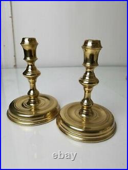 Lot of brass candle sticks. Two Baldwin brass and one Virginia MetalCrafters