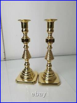 Lot of brass candle sticks. Two Baldwin brass and one Virginia MetalCrafters