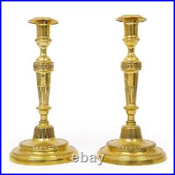 Pair of French Directoire Incised Brass Candlesticks, early 19th century