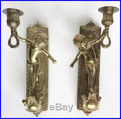 Pair of brass cherub candleholder sconces
