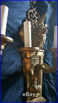 Pair of heavy brass sconces candelabras Northwind face