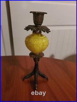 Rare brass tealight candle holder. Yellow glass with chicken foot