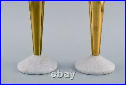 Tom Dixon, British designer. A pair of candlesticks in brass and marble